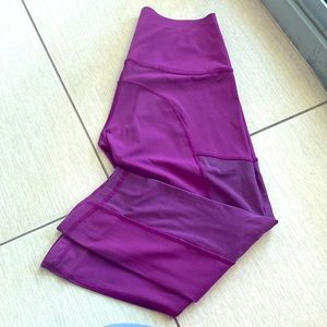 Lululemon purple crop legging with sheer mesh on leg Size 6